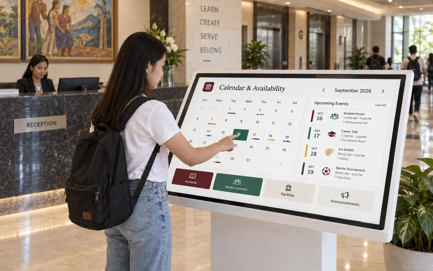 Student using a large touchscreen kiosk to check the public school calendar and upcoming events in a campus lobby.